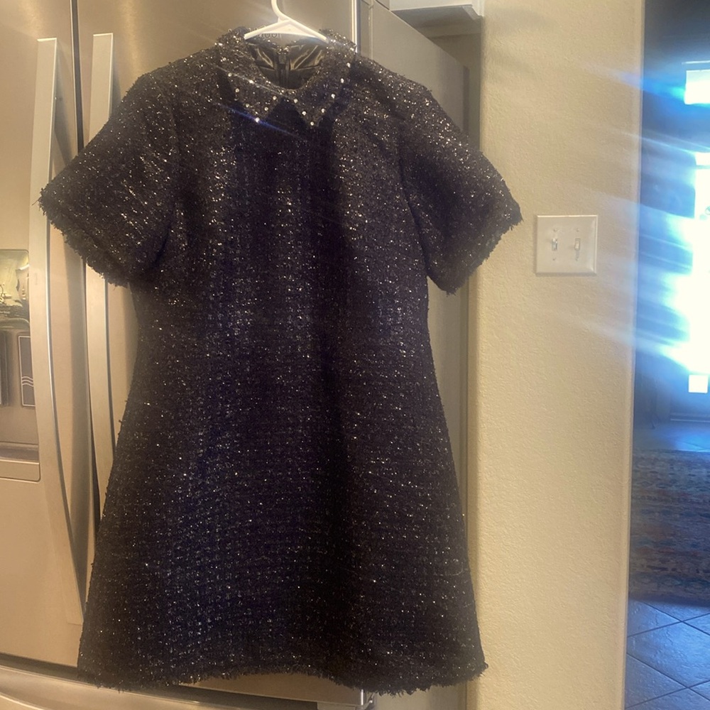 Sparkly Authentic Kate Spade black beautiful dress with fringe hemming.
